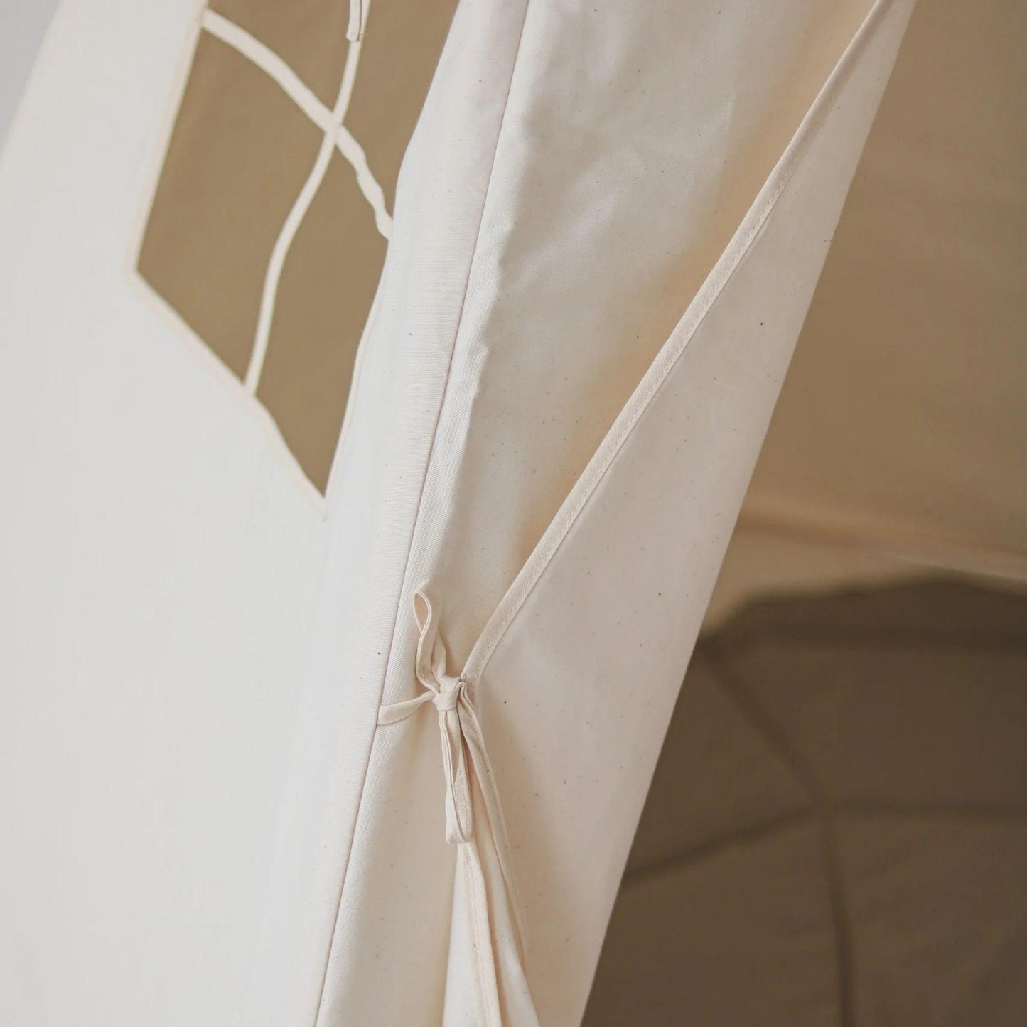 Close-up of a beige fabric with geometric patterns
