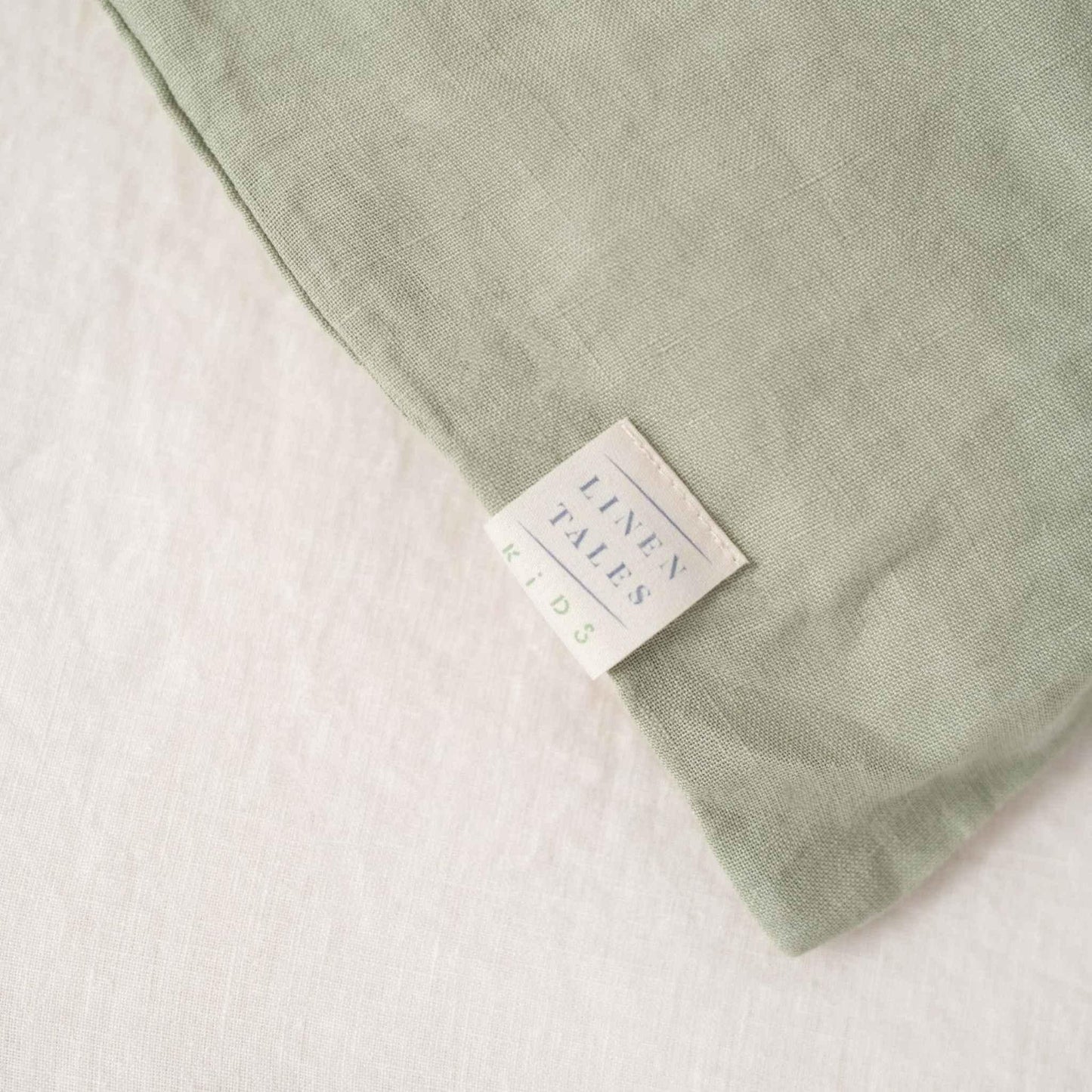 Green fabric with a label on a white background