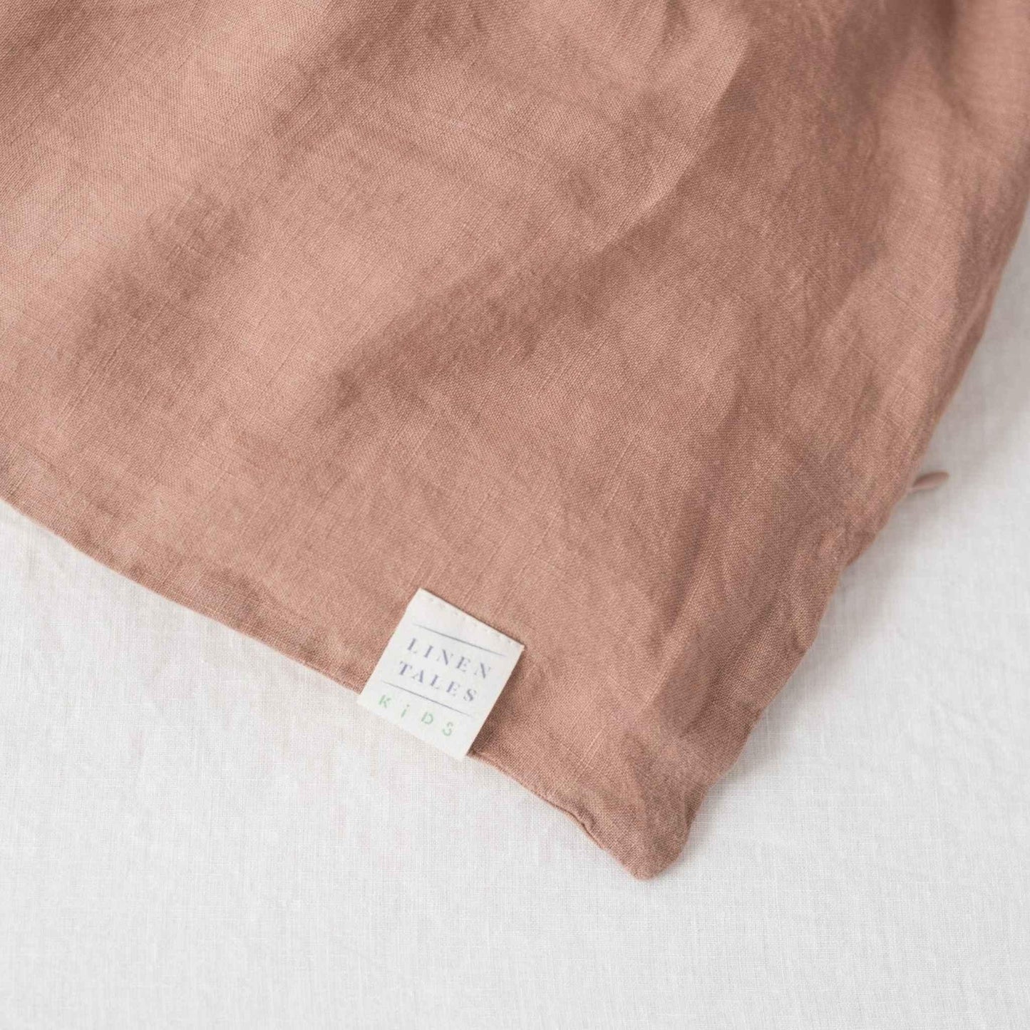 Brown fabric with a label on a white background