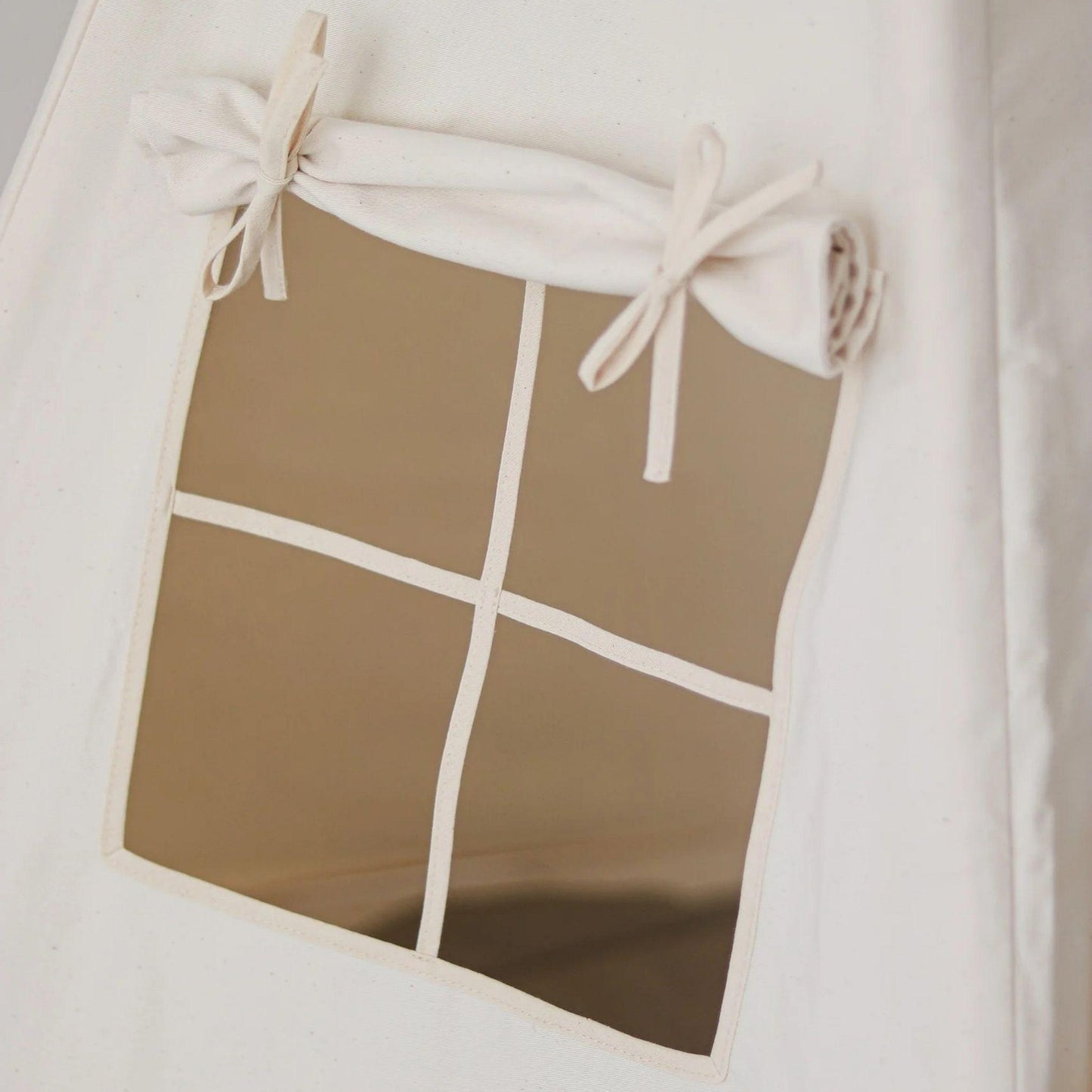 Small tent with a window, featuring a grid pattern on a plain background