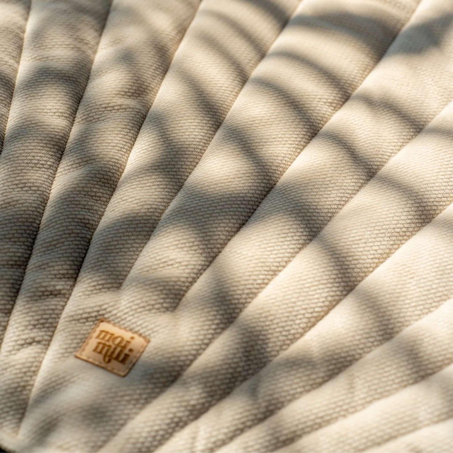 Textured fabric with a brand label in the corner