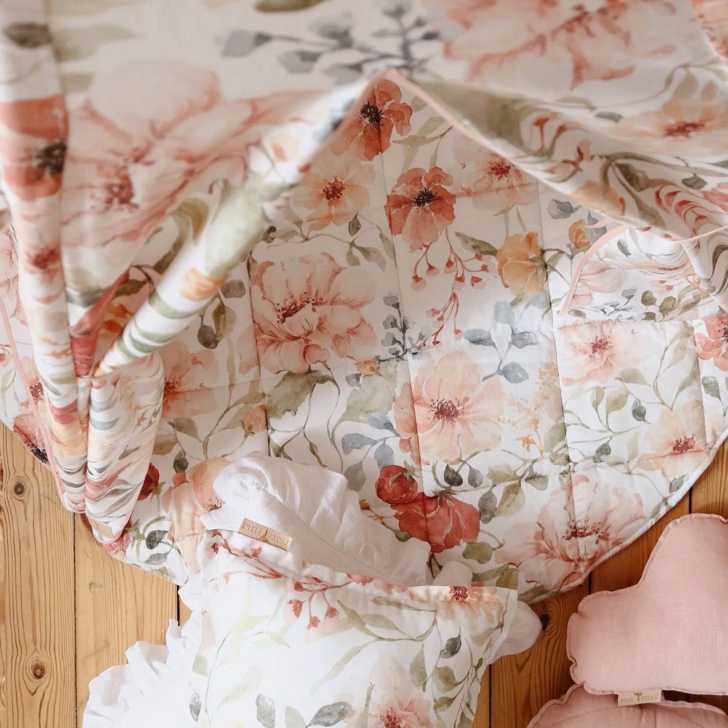 Floral-patterned fabric draped over a wooden surface