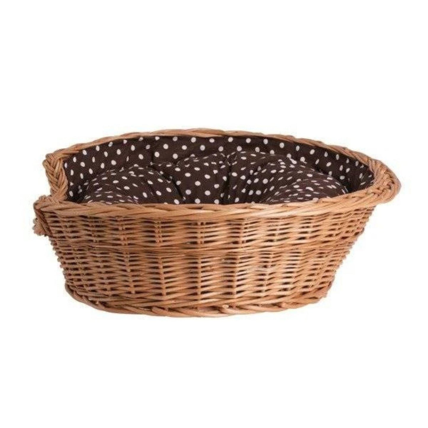 Wicker pet bed with a brown and white polka dot cushion on a white background