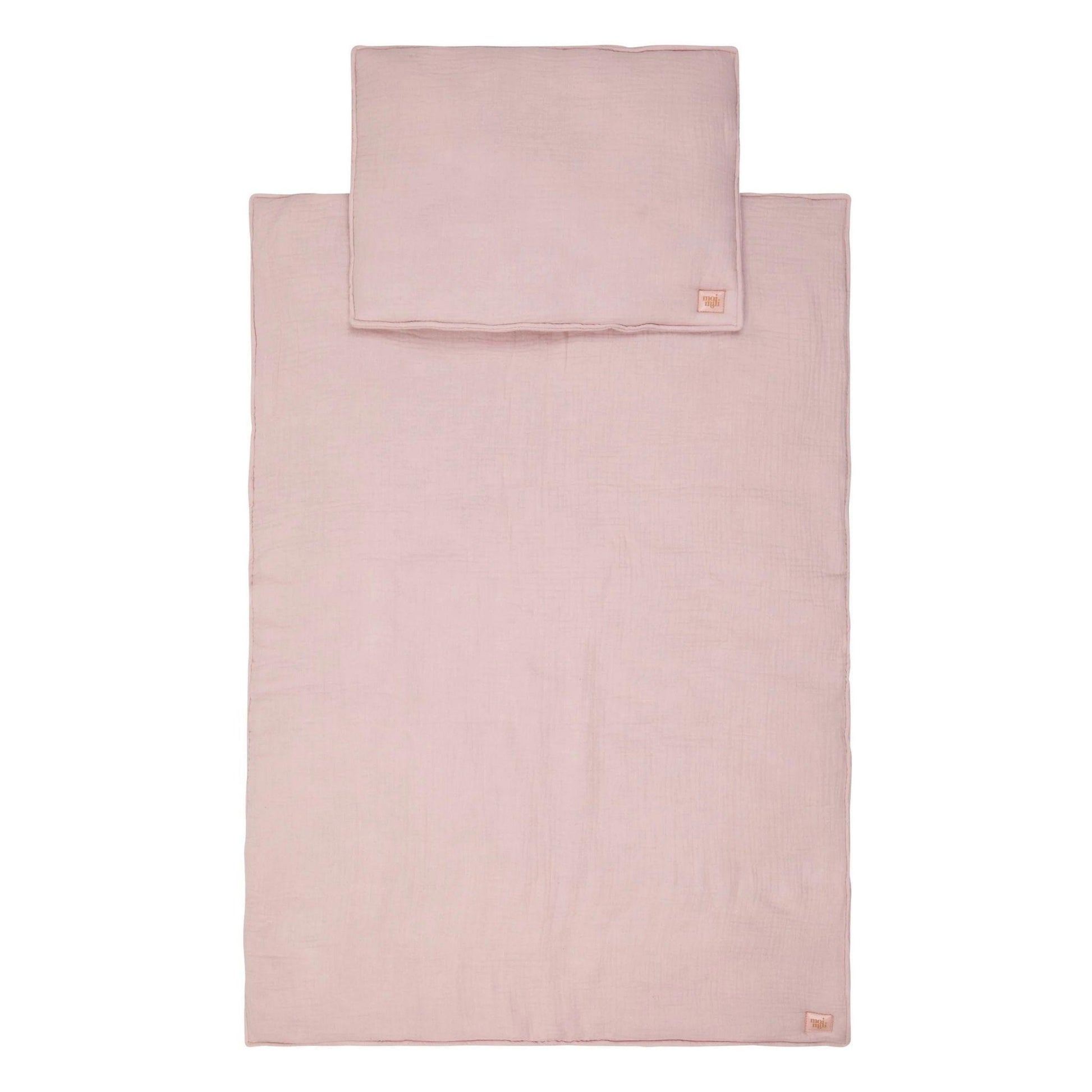 Pink bed sheet set with pillowcase on a white background
