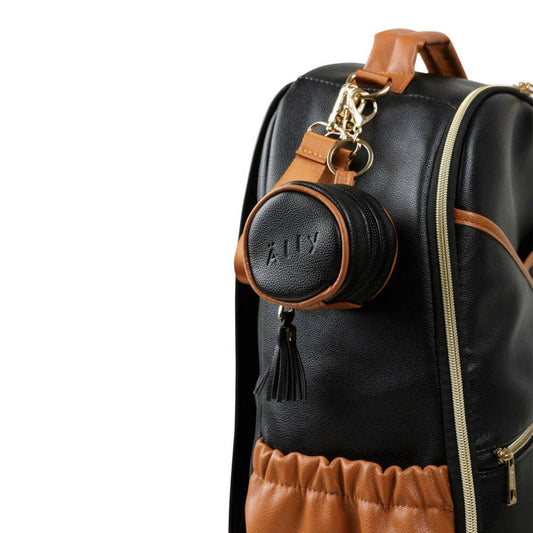 Black backpack with a round black pouch featuring 'Älly' branding on a white background
