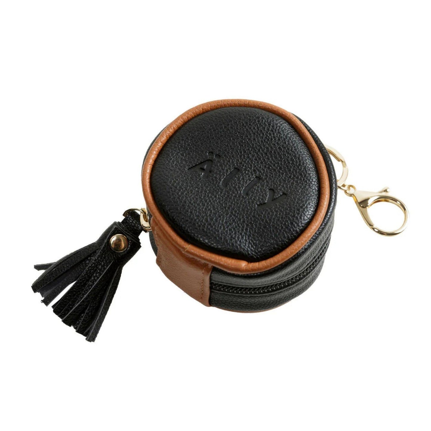 Round black leather pouch with brown leather top and tassel on a white background