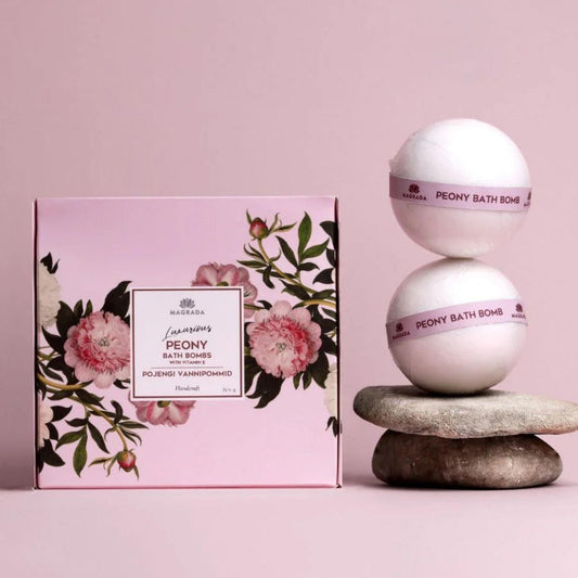 Peony bath bombs with packaging on a pink background