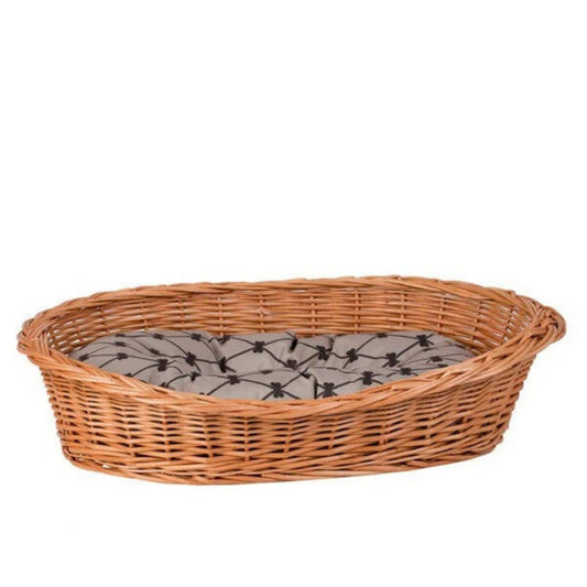 Wicker pet bed with a gray cushion on a white background