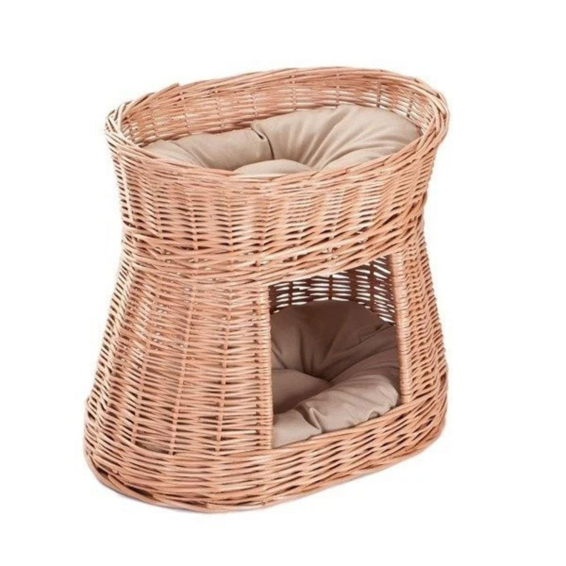 Wicker pet bed with cushion on a white background