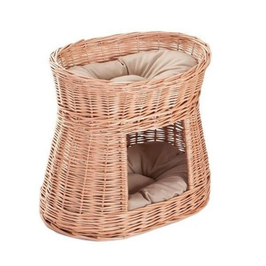 Wicker pet bed with cushion on a white background